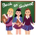 Back to School. Three cute schoolgirls
