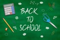 Back to school title written in a chalkboard with realistic 3D items like pencil, scissor and clips