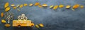 Back to school. Top view banner of cardboard school bus with wooden gears as concept of success and achievement next to autumn dry