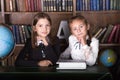 Back to school. Portrait of two girls, first graders.