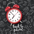 Back to school vector illustration. Realistic 3d red alarm clock on black board background with doodle school supplies. Royalty Free Stock Photo