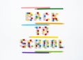 Back To School words made of number beads and underlined with colourful pencils. Royalty Free Stock Photo