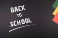 Back to School written on Blackboard, colorful papers on the side simple colorful design