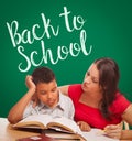 Back To School Written On Chalk Board Behind Hispanic Young Boy Royalty Free Stock Photo