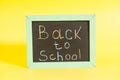 Back to School written on a chalkboard Royalty Free Stock Photo