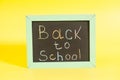 Back to School written on a chalkboard Royalty Free Stock Photo