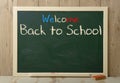 Back to school written on green blackboard Royalty Free Stock Photo