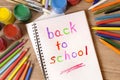 Back to school written in an open book, desk, pencils, classroom Royalty Free Stock Photo