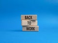 Back to Work symbol. Wooden blocks with words Back to Work. Beautiful blue background. Business and Back to Work. Copy space