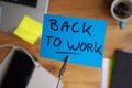 Back to work written on a memo Royalty Free Stock Photo
