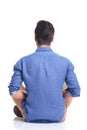 Back veiw of a seated young brunette man