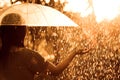 Back veiw of woman with umbrella in the rain and sunlight Royalty Free Stock Photo