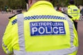 Back of the vest of a London Metropolitan Police Officer in Hi-visibility Uniform