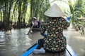 Back of vietnamese waman on the Mekong river, Vietnam Royalty Free Stock Photo