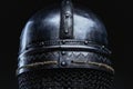 Back view of antique steel helmet in dark background