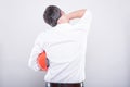 Back view of architect holding hardhat suffering neck pain Royalty Free Stock Photo