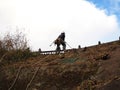 Worker use equipment climbing to the mountain