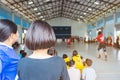 Back view of asian parents cheering childrens learn to playing volleyball Royalty Free Stock Photo