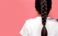 Back view of Asian woman with braided hairstyle is cutting with scissors for donate to cancer patients. Hair donation for breast