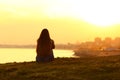 Woman seeing a sunset on the city Royalty Free Stock Photo