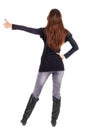 Back view of of beautiful brunette woman in jeans going thumb up Royalty Free Stock Photo