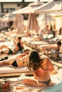 back view of beautiful girl in bikini with wet hair on the beach Royalty Free Stock Photo