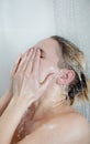 Back view of beautiful naked young woman taking shower Royalty Free Stock Photo