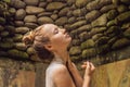 Back view of beautiful naked young woman taking shower in bathroom Royalty Free Stock Photo