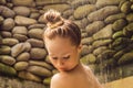 Back view of beautiful naked young woman taking shower in bathroom Royalty Free Stock Photo