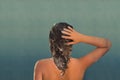 Back view of beautiful naked young woman taking shower in shower cabin. Royalty Free Stock Photo