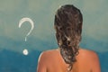 Back view of beautiful naked young woman taking shower in shower cabin. Soap question mark on shower cabin in the bathroom. Royalty Free Stock Photo