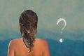 Back view of beautiful naked young woman taking shower in shower cabin. Soap question mark on shower cabin in the bathroom. Royalty Free Stock Photo