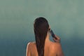 Back view of beautiful naked young woman taking shower in shower cabin. Royalty Free Stock Photo