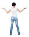 Back view of Beautiful woman in jeans looking at wall and Holds Royalty Free Stock Photo