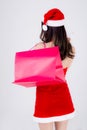 Back view beautiful young asian woman thinking and holding credit card and shopping bag with excited isolated Royalty Free Stock Photo