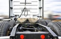 Back view of big rig semi truck tractor with fifth wheel and chassis