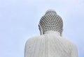 Back view of big white marble Buddha with cloudy sky background, copy space, Phuket, Thailand Royalty Free Stock Photo