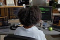 Back View of Black Female Coder Writing Program Royalty Free Stock Photo