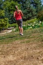 Back view of blond woman practicing fitness in park