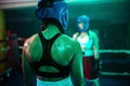 Back view of boxer girls strong back during active bout