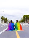 Boys couple with rainbow colored shirt.. Concept of LGBT pride. AI generated