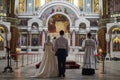 Back view of bride and groom in church