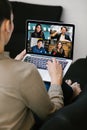 Back view of business latin woman talking to her mexican colleagues in video conference business team using laptop for a online Royalty Free Stock Photo