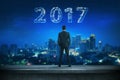 Back view business man looking 2017 on the sky Royalty Free Stock Photo