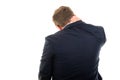 Back view of business man showing neck pain gesture Royalty Free Stock Photo