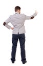 Back view of business man shows thumbs up. Royalty Free Stock Photo