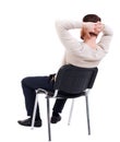 Back view of business man sitting on chair. Royalty Free Stock Photo