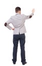 Back view of business manr in jacket and helmet presses his hand Royalty Free Stock Photo