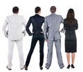 Back view of business people looks at wall. Royalty Free Stock Photo