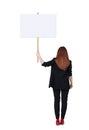 Back view business woman showing sign board. Royalty Free Stock Photo